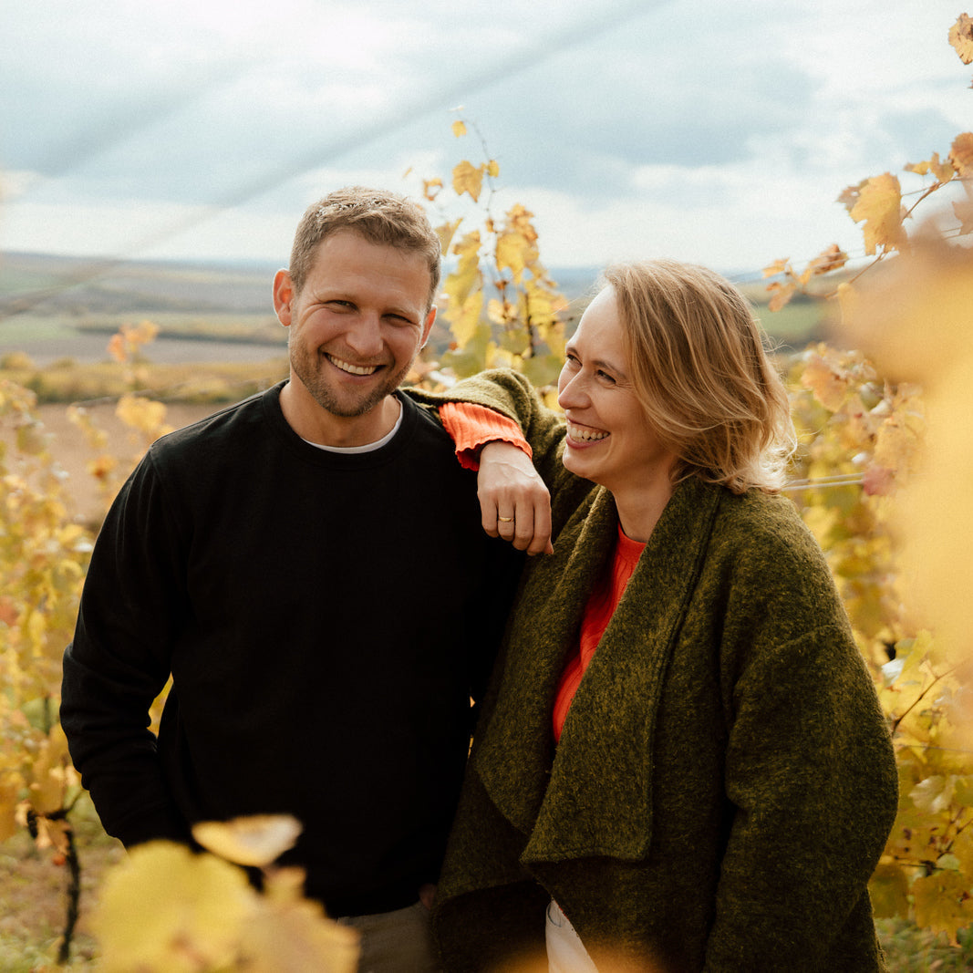 Jakub Herzán and Šárka Betke smiling in their Moravian vineyard in Kobylí, representing The Lacery’s slow-living philosophy.